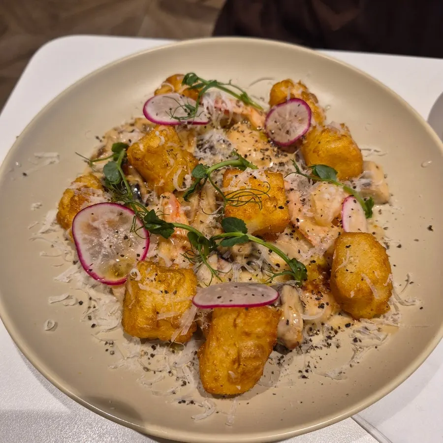 Shrimp gnocchi in porcini mushroom cream sauce