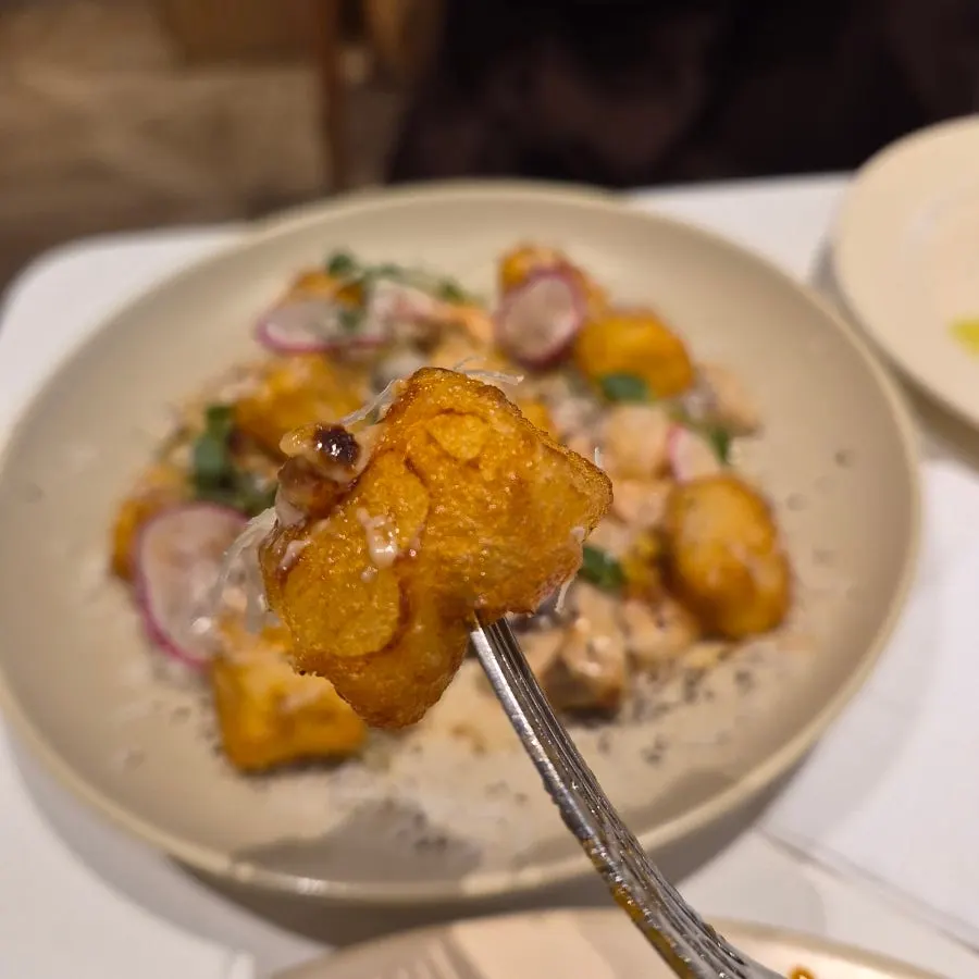 Gnocchi tossed in cream sauce with plump shrimp