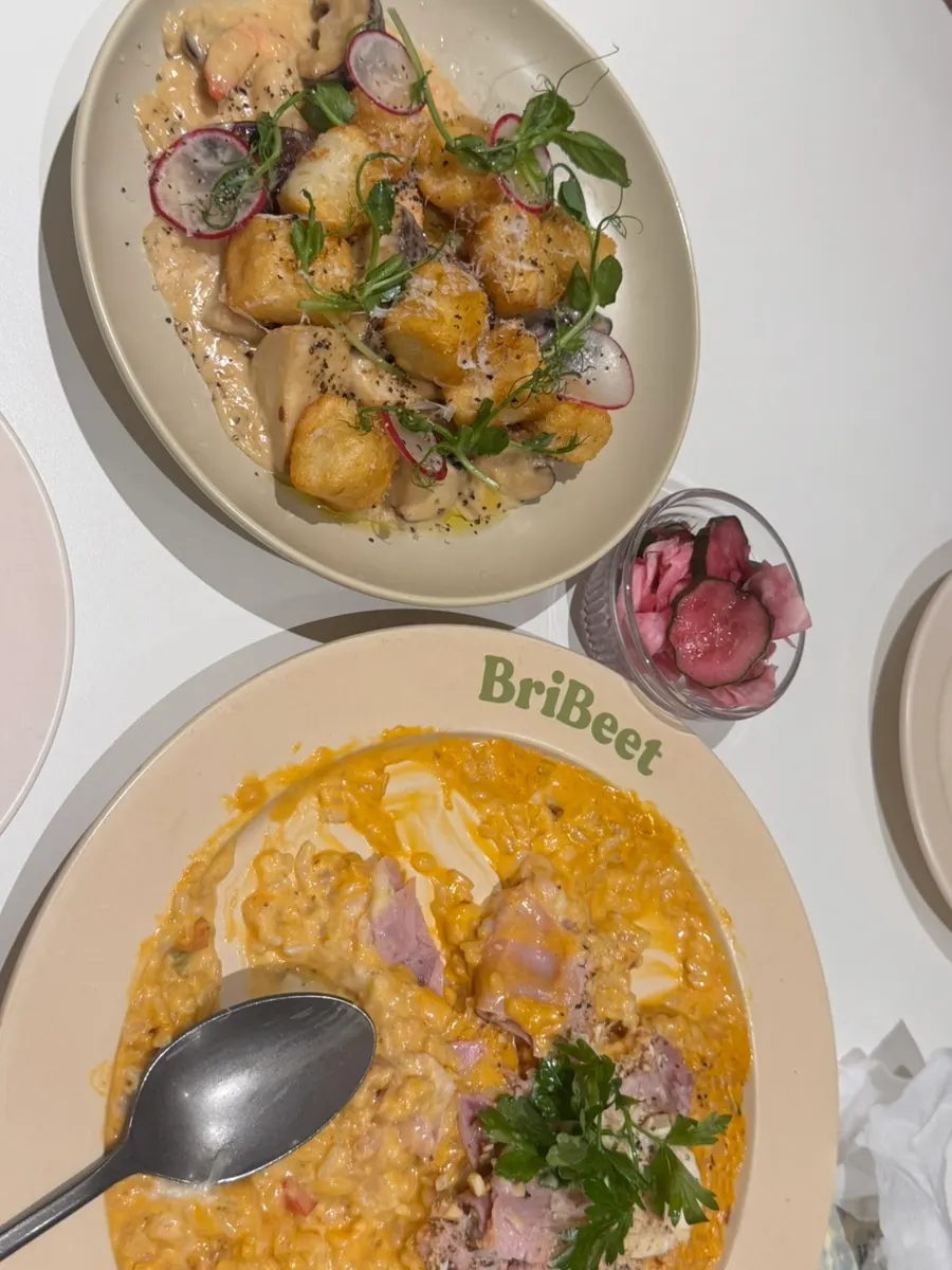 Spicy jambon risotto topped with pistachio and jambon beurre ham