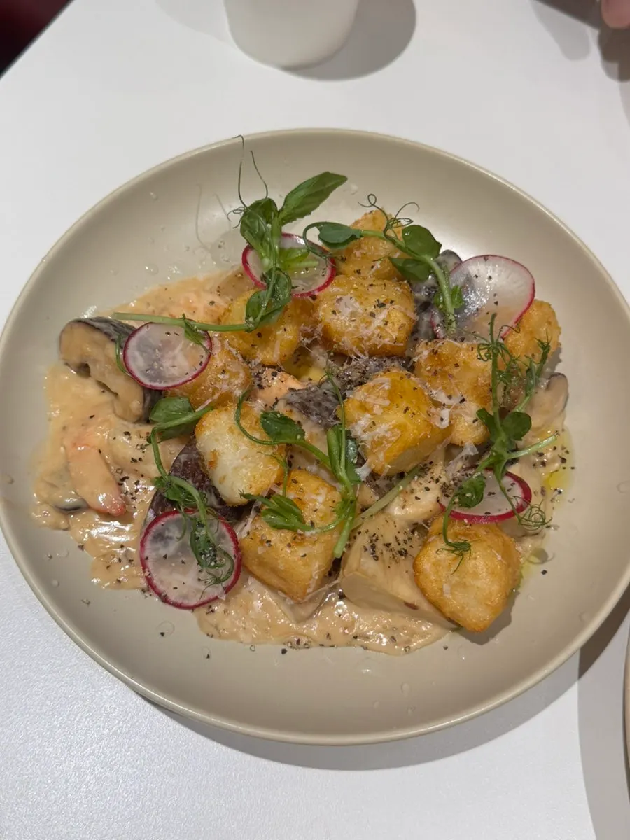 Porcini shrimp gnocchi topped with big shrimp