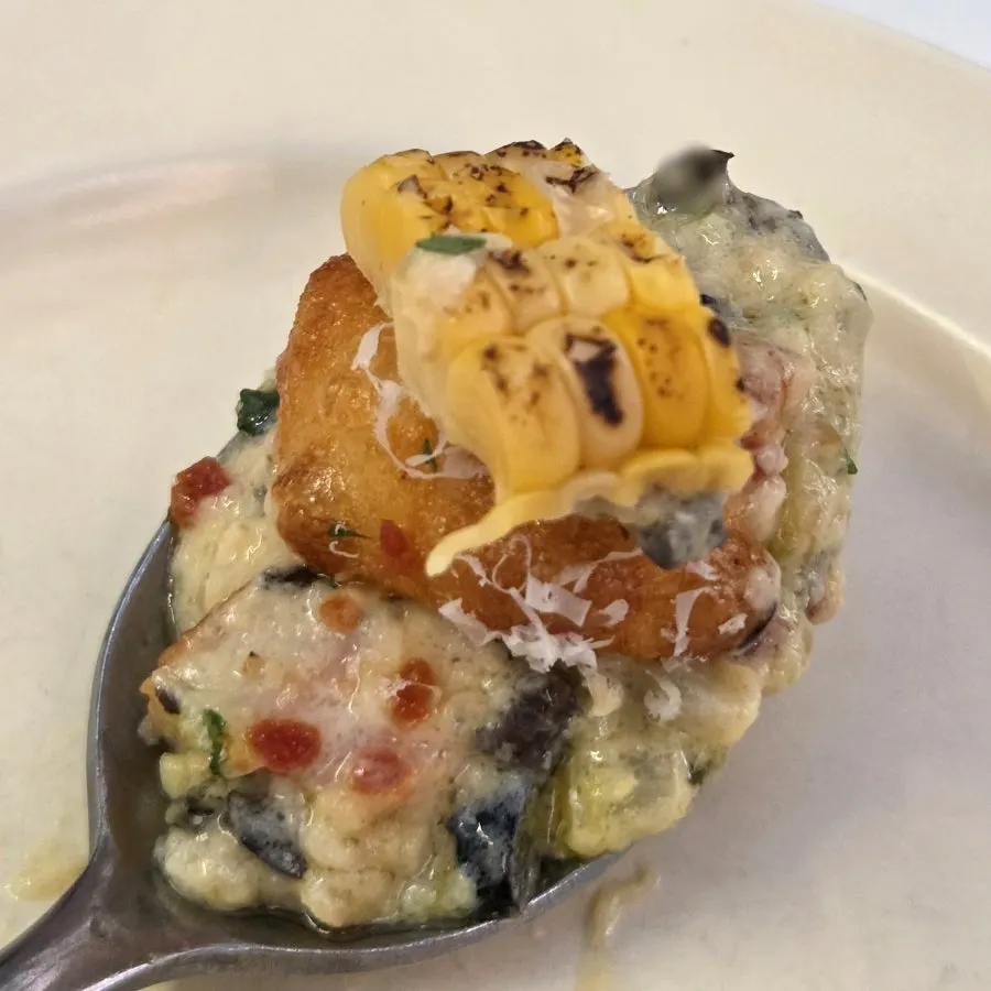 Cross-section of gnocchi with green onion cream sauce
