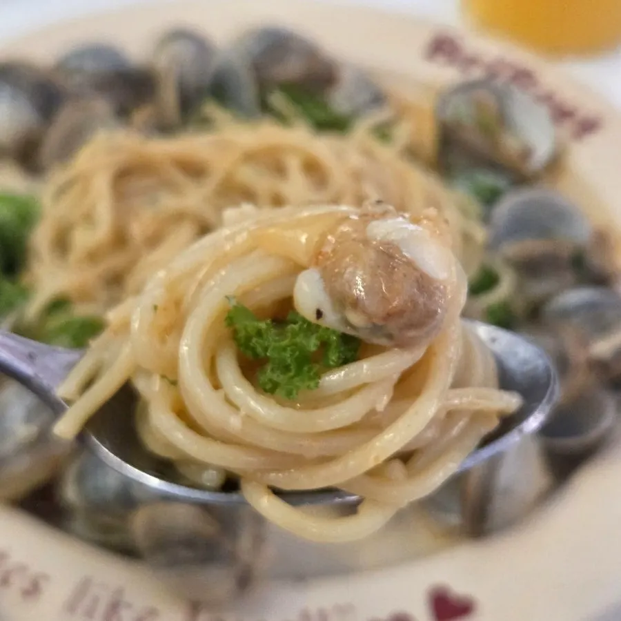 Spicy vongole oil pasta showing bits of peperoncino