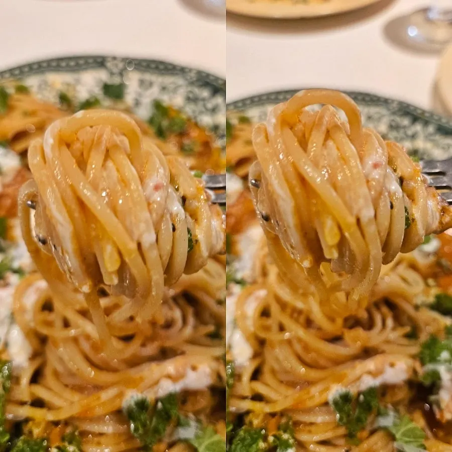 Scooping a bite of the salmon steak pasta