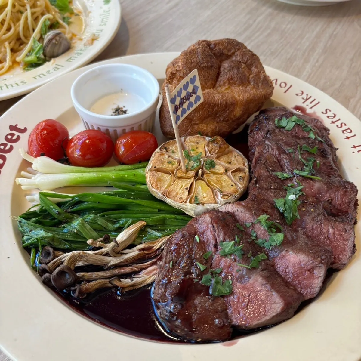 Table spread of Brivit Gangnam's signature steak and pasta