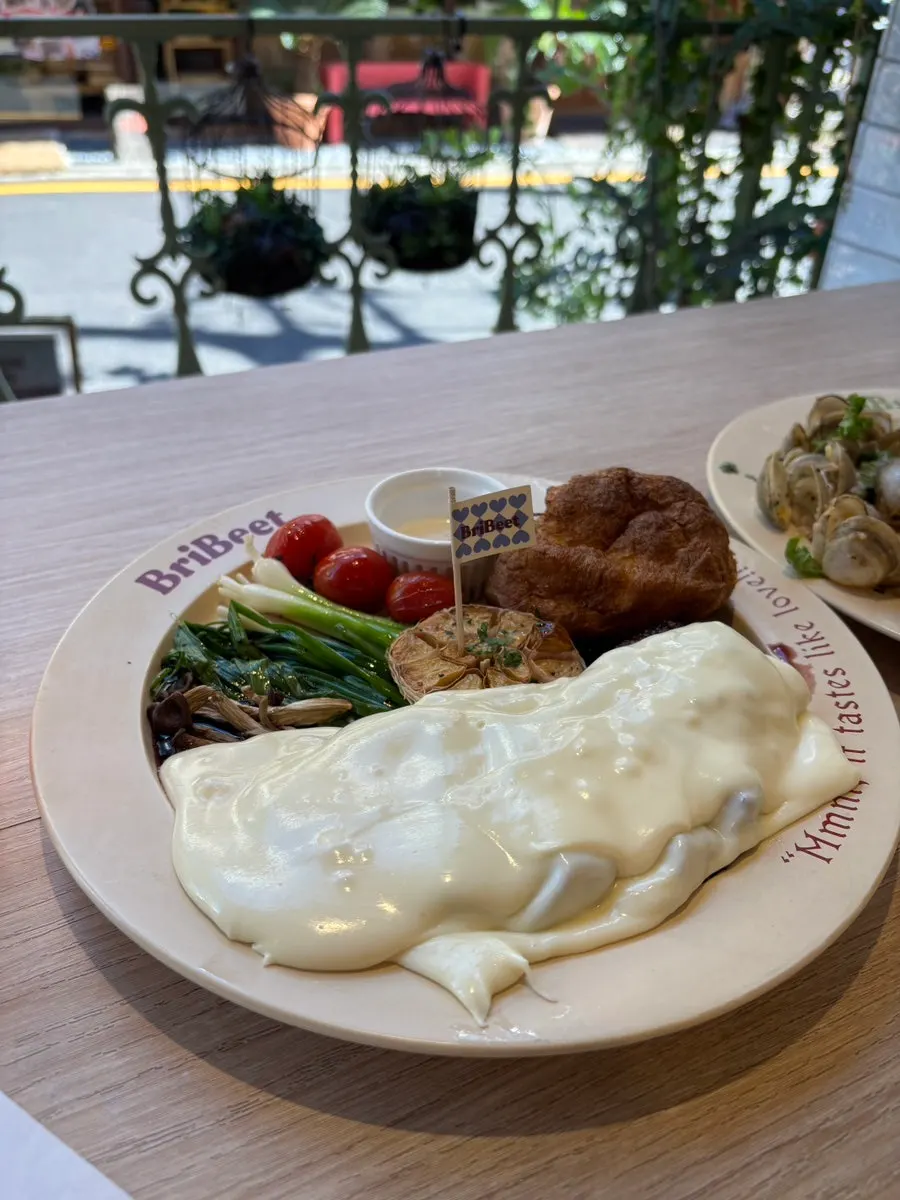Signature steak topped with aligot cheese