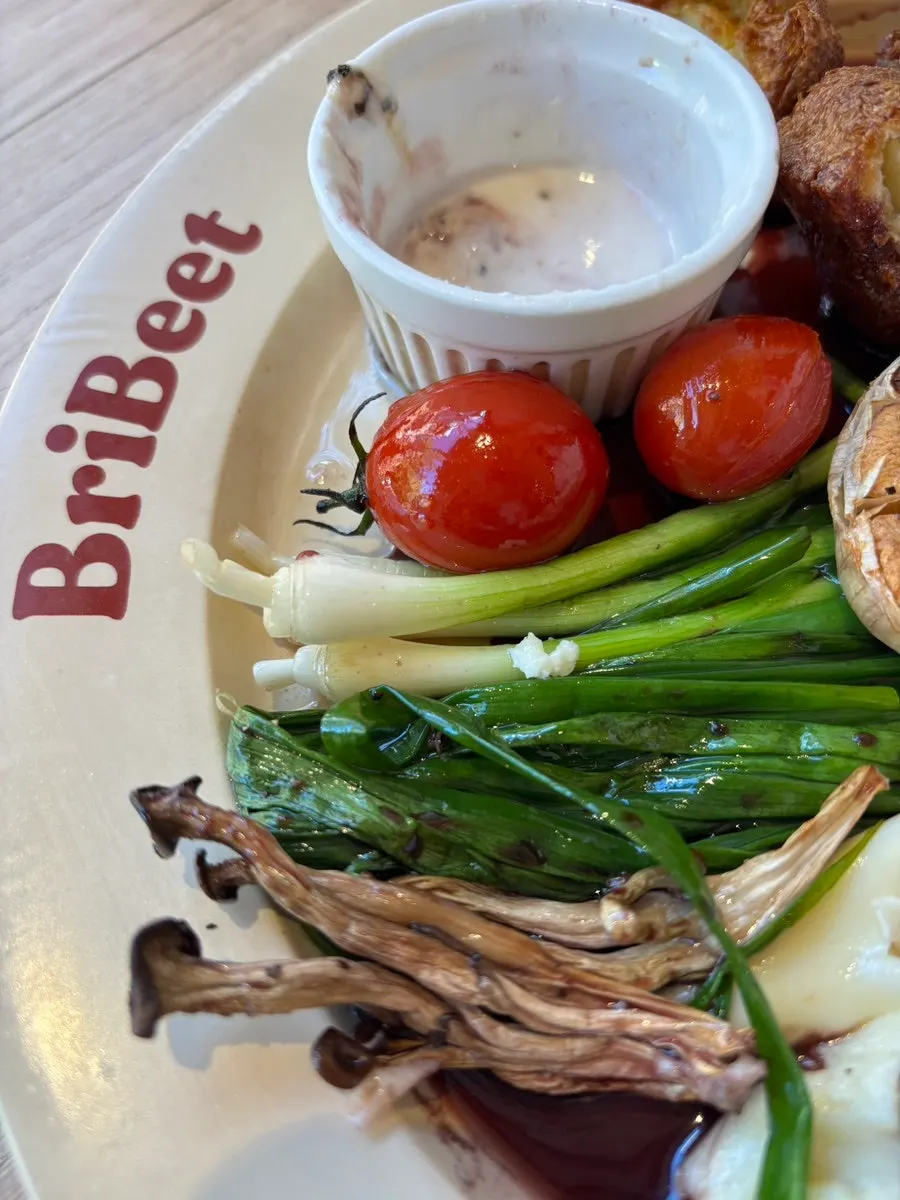 Steak set with grilled scallions, grilled garlic, and bread