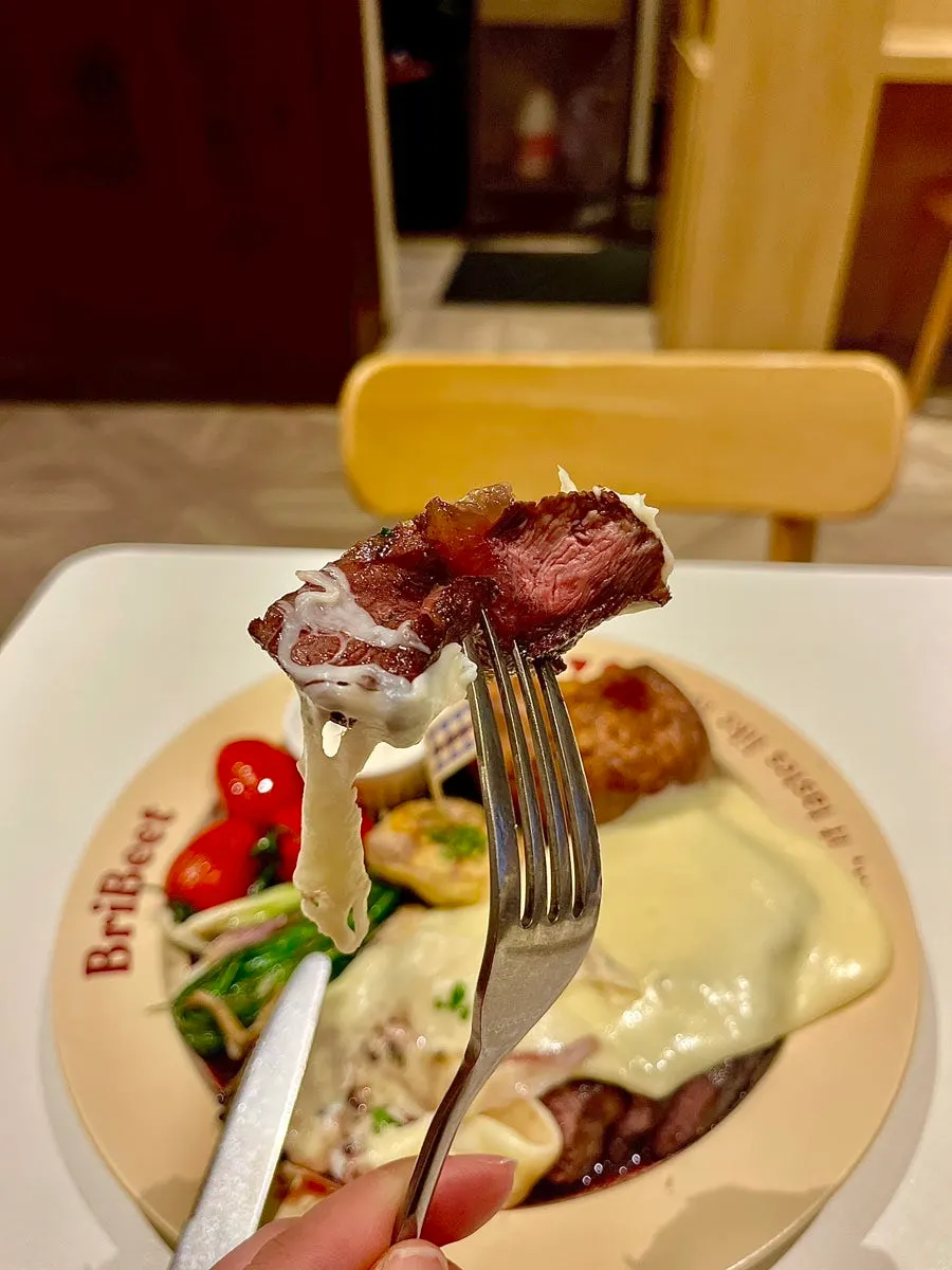French aligot cheese stretching on a fork
