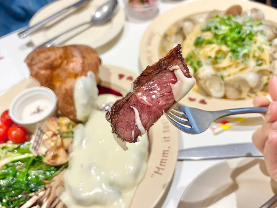 A piece of steak dipped in sauce