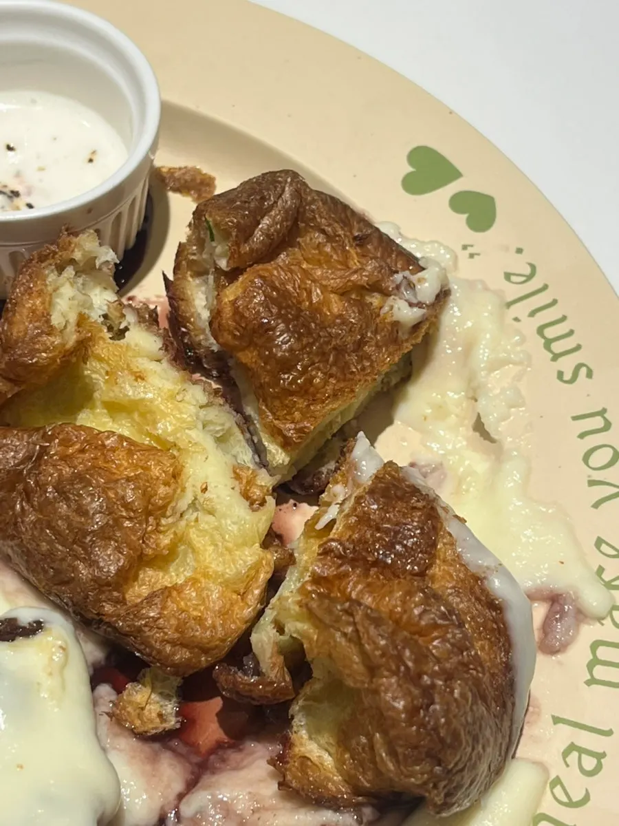 A bite of steak wrapped in green onion