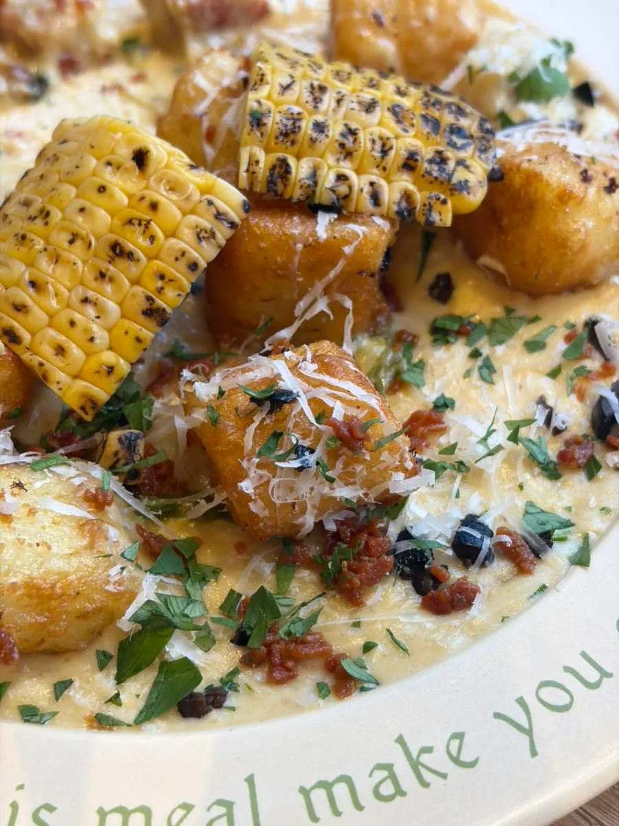 Close-up of green onion cream corn gnocchi
