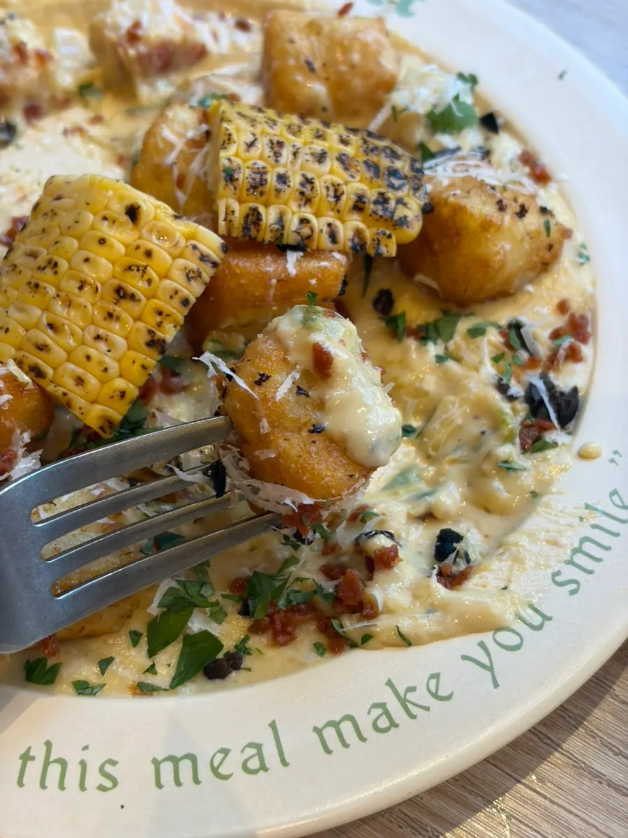 Bite-sized gnocchi with green onion cream sauce