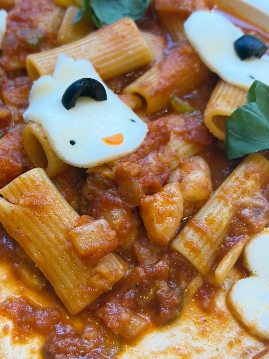Tomato pasta topped with rabbit-shaped cheese