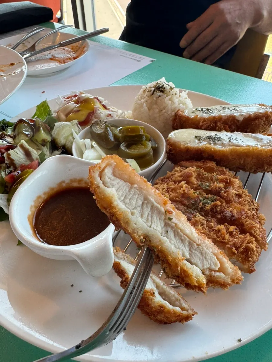 Cross-section of a thick, crispy-fried pork cutlet