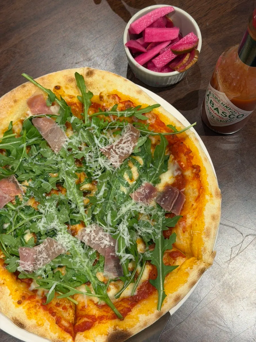 Pizza and pasta laid out on the table at Bueokgan