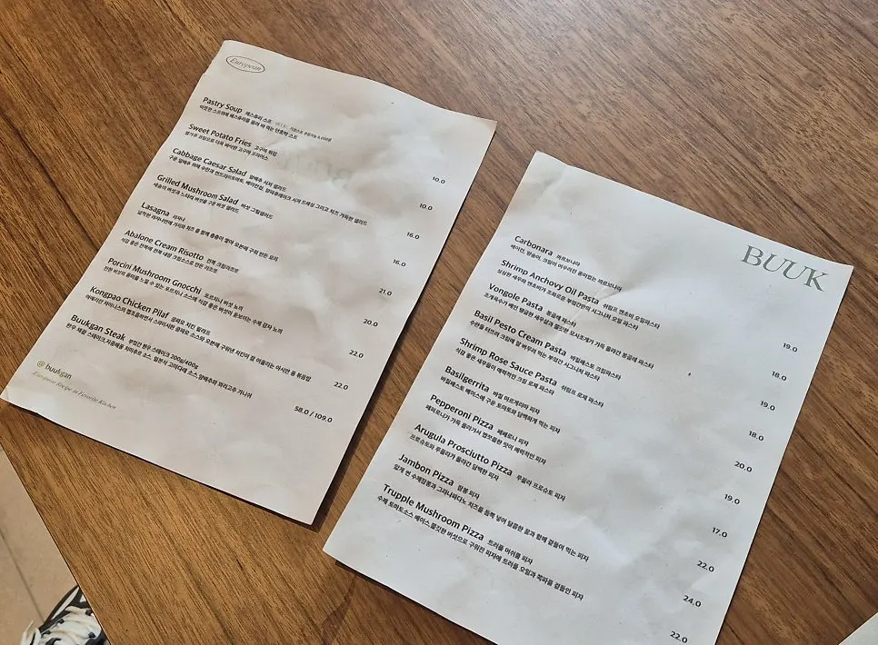 Paper menu and waiting area at Bueokgan