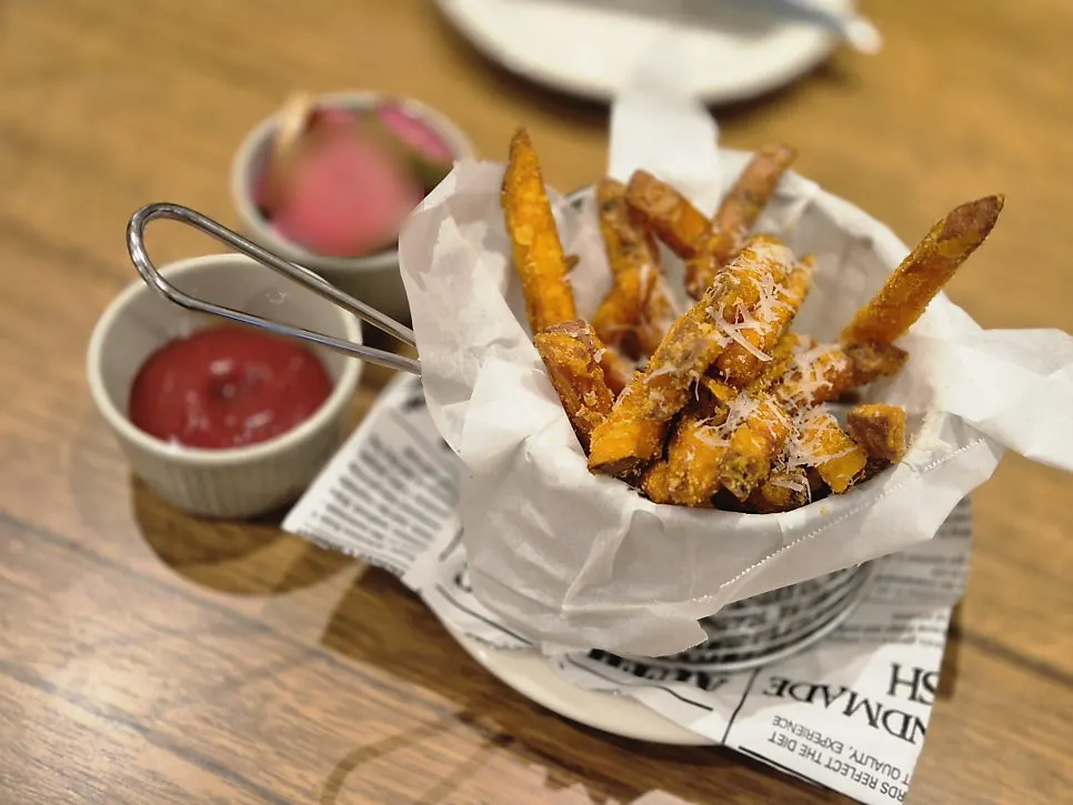 Plate of sweet potato fries served with ketchup