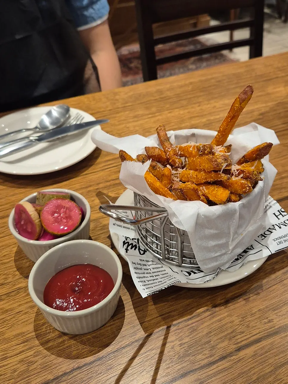 Nearly empty plate of sweet potato fries