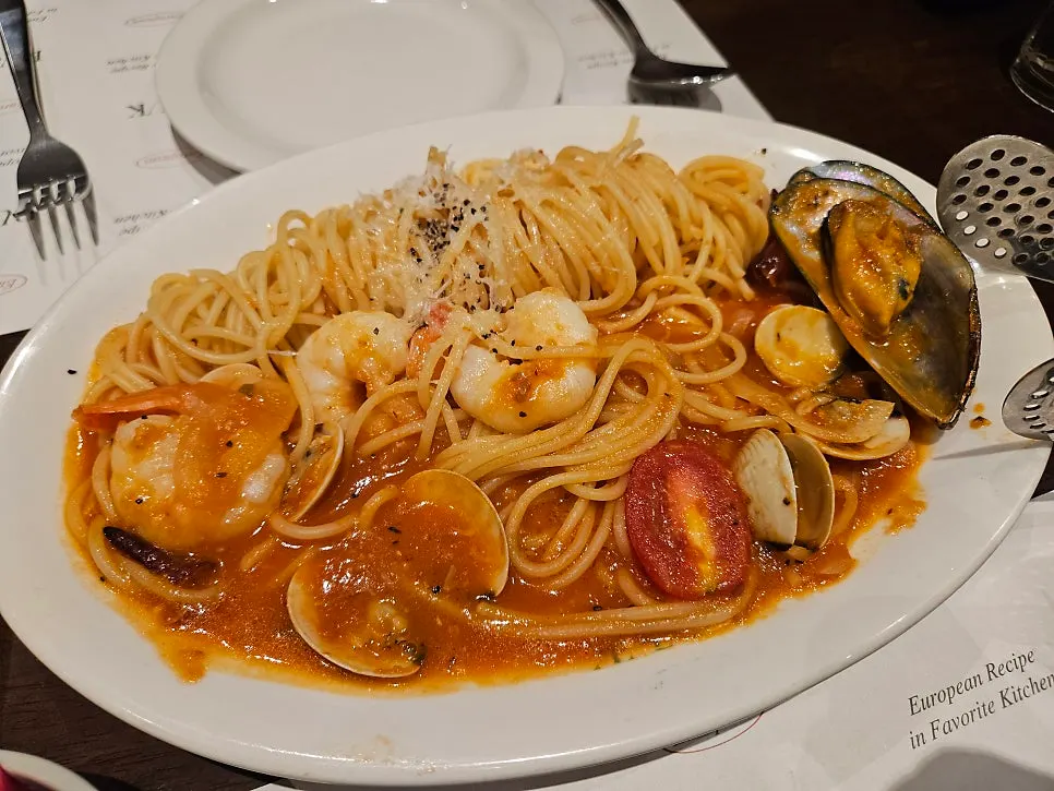 The seafood tomato pasta and abalone cream risotto served first