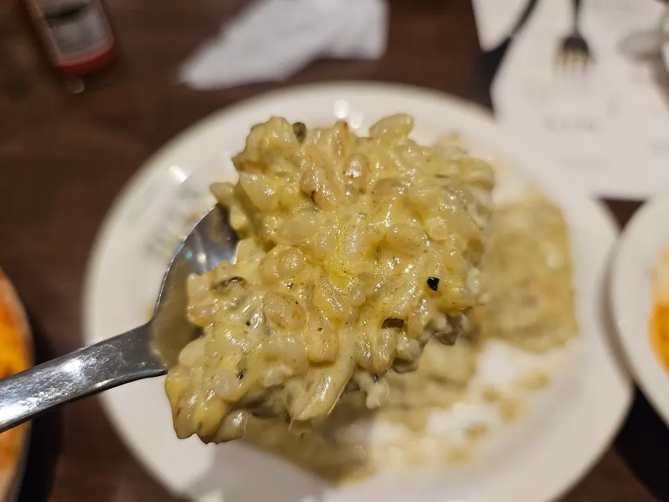 Close-up of pasta noodles coated in tomato sauce