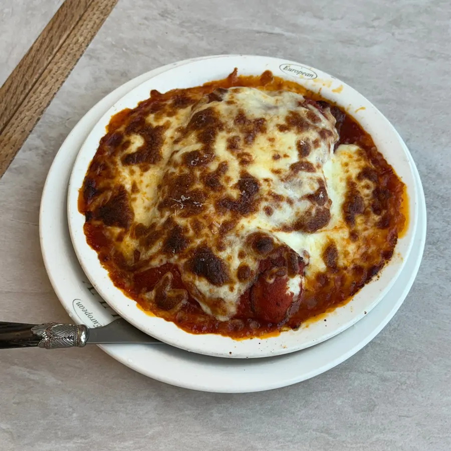 Lasagna layered with cheese and tomato sauce