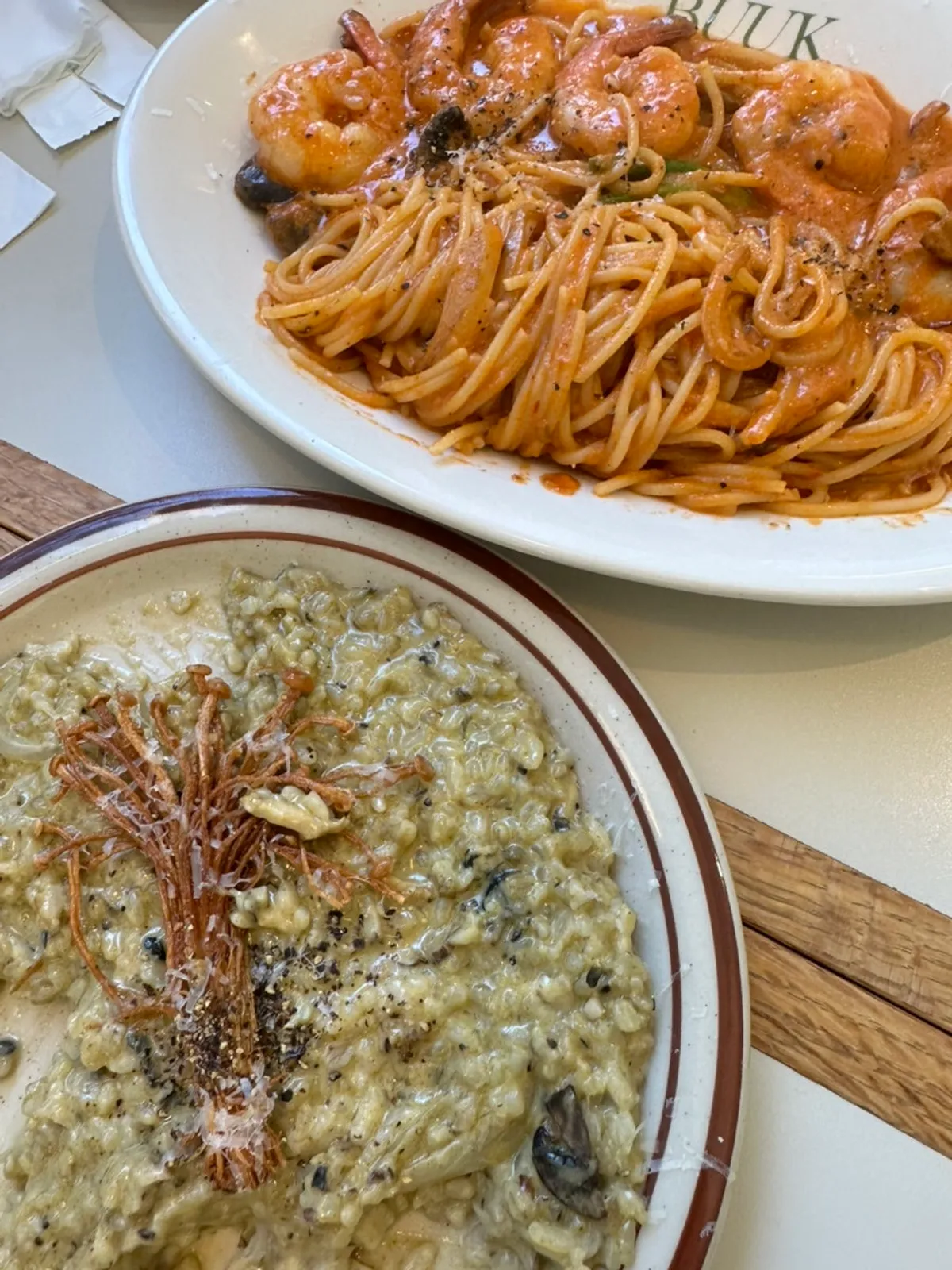 Table set with pasta, risotto, and pizza