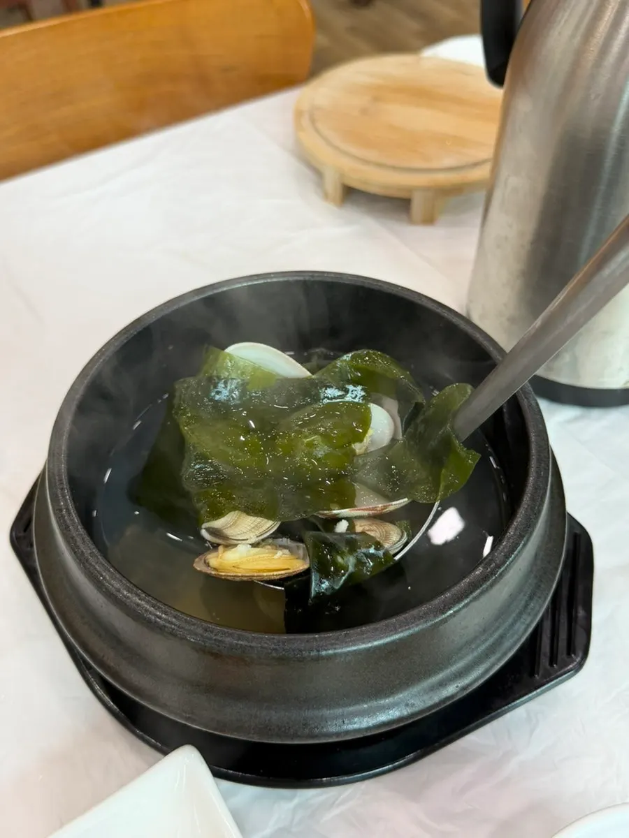 Complimentary clam seaweed soup packed with clams
