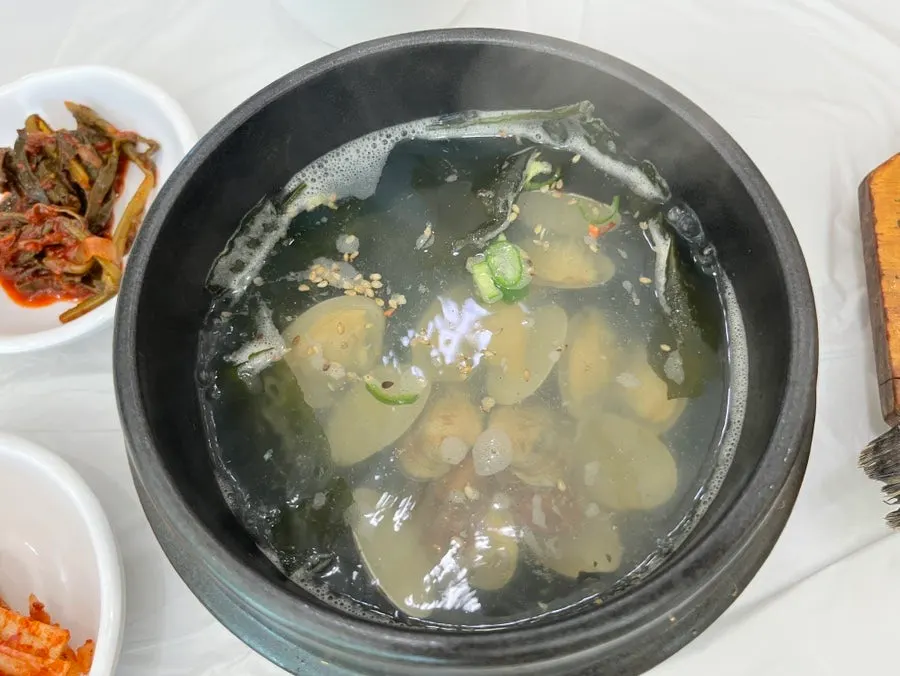 Clam soup served in a hot stone pot