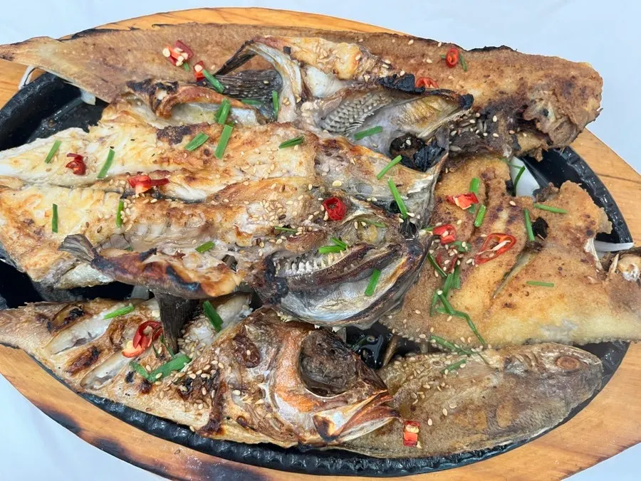 Assorted grilled fish on the grill plate