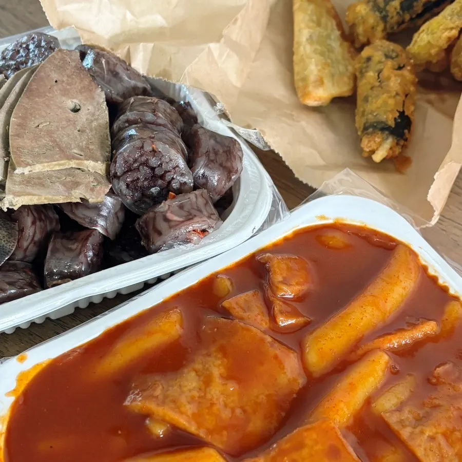 Tteokbokki, sundae, and fried snacks lineup at Bubu Duri Tteokbokki