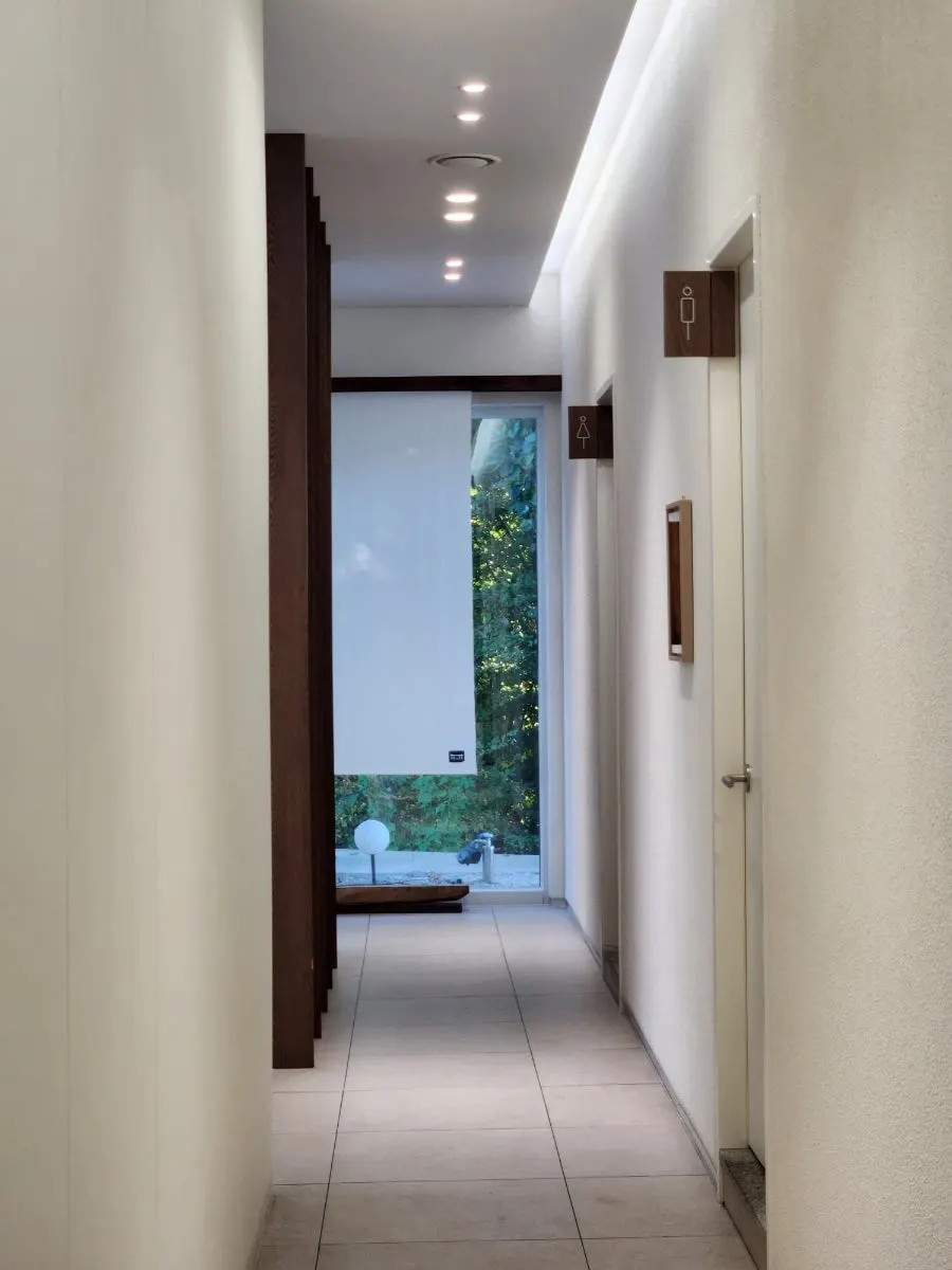 Elegant dining space finished with aged wood and hanji paper