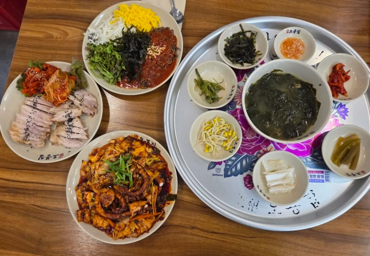 The Obongjip Special spread with grilled octopus, bossam, and mak-guksu