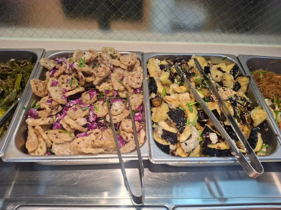 Self-serve bar with fried lotus root and side dishes