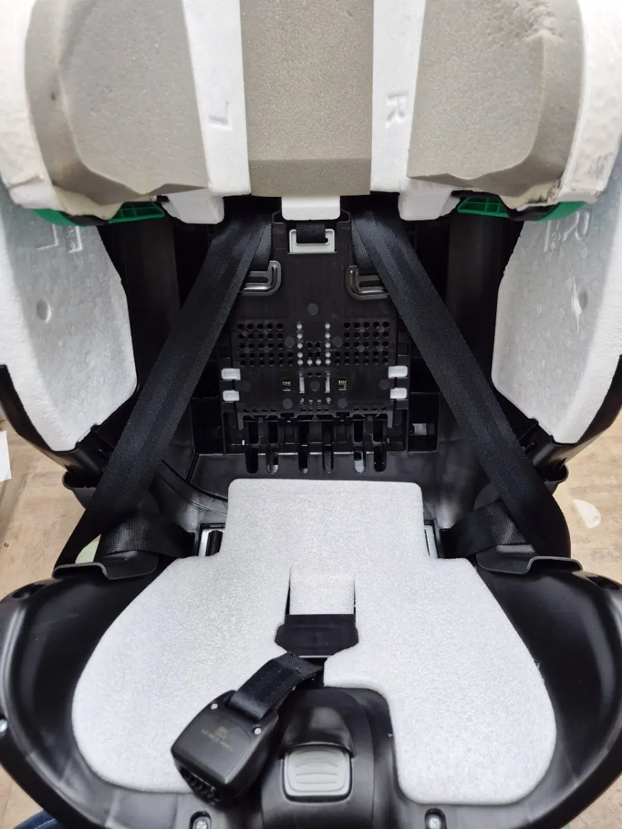 Fully disassembled car seat during the washing process