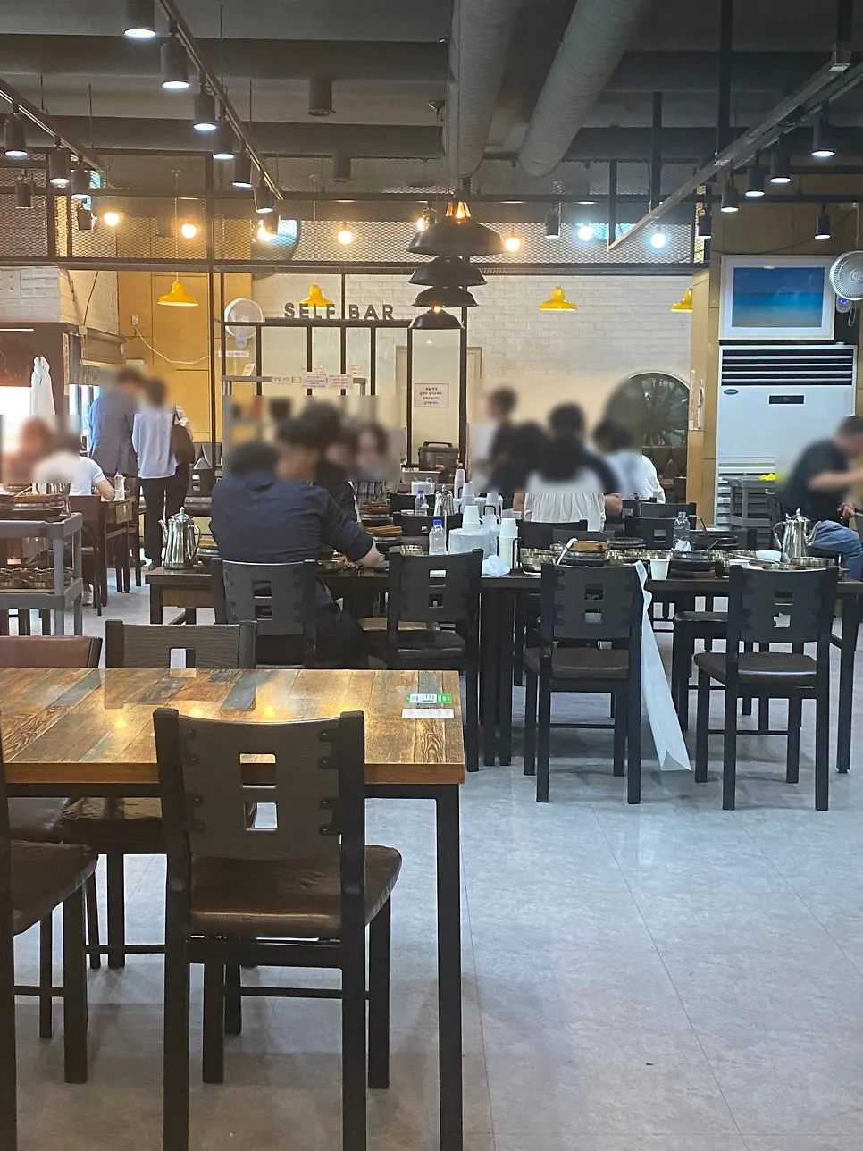 Self-bar of banchan in the center of the restaurant