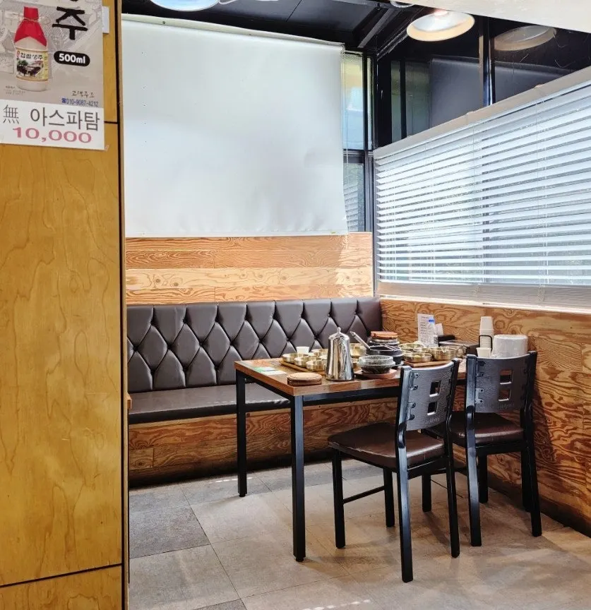 Spacious Korean restaurant interior with four-person tables