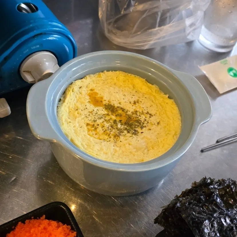 Jjukkumi wrap topped on pickled radish