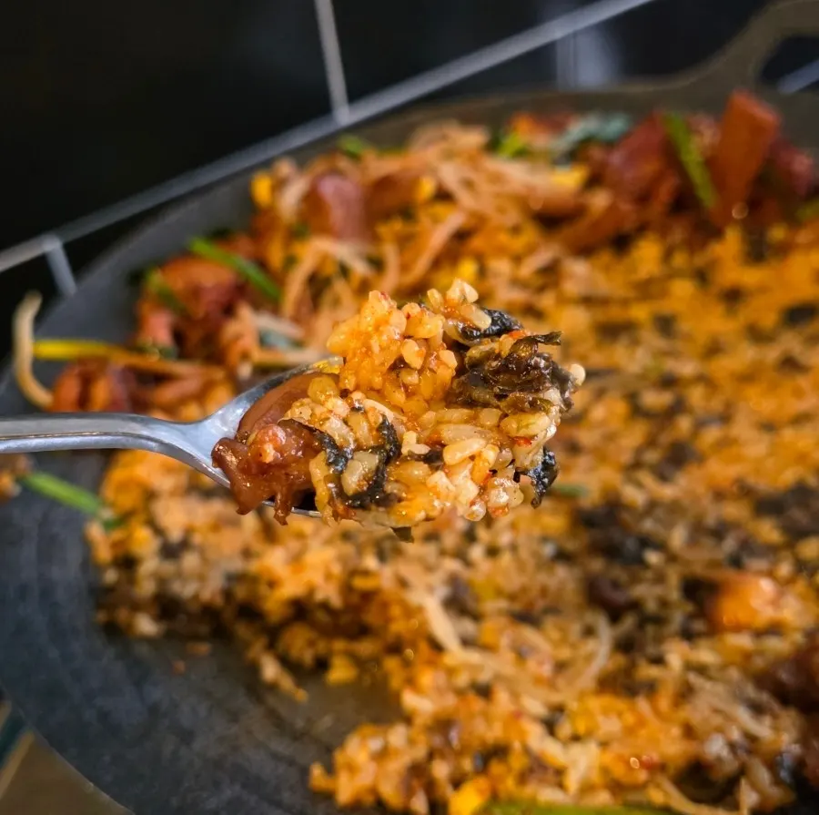 Flying fish roe fried rice cooking on the hot plate