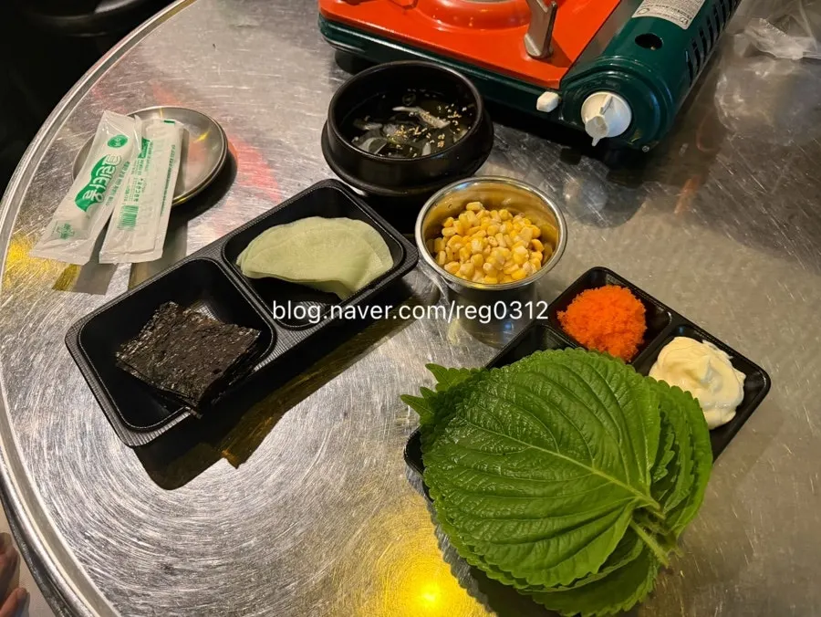 Basic side dish spread with seaweed, pickled radish, and flying fish roe