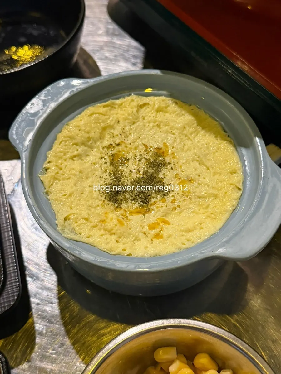 Side dishes and wraps served alongside jjukkumi