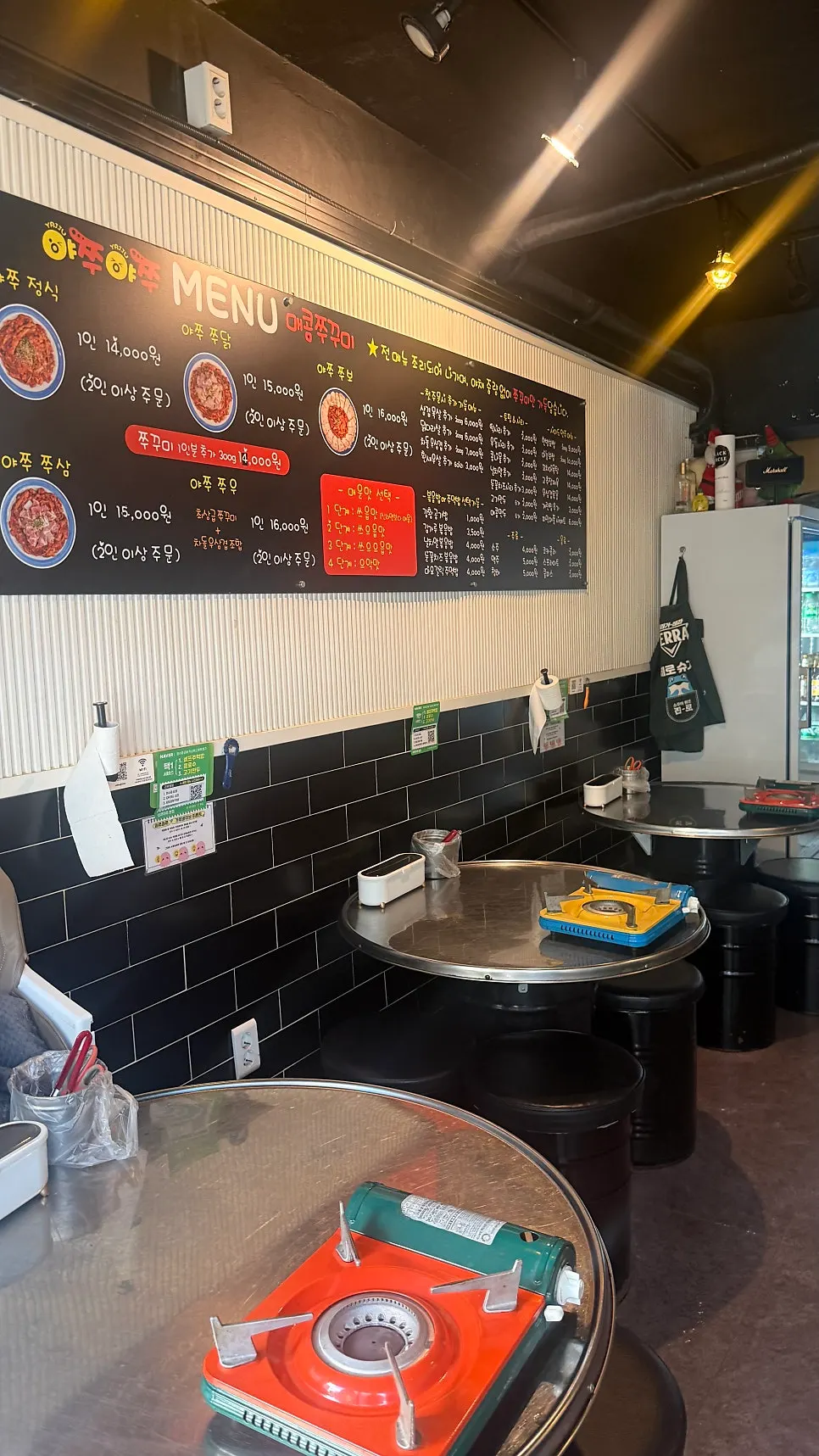 Seating and wall signage at the jjukkumi restaurant