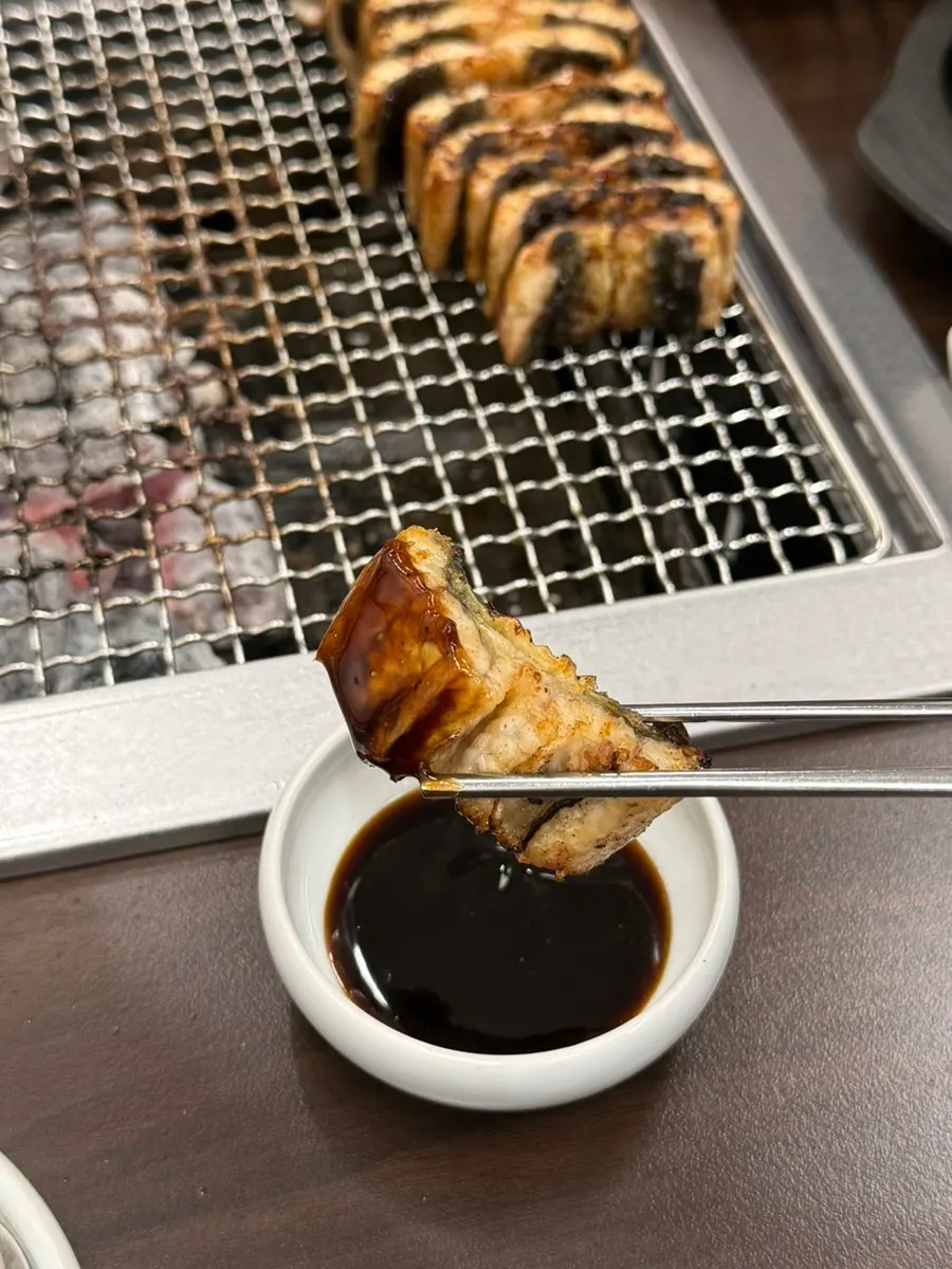 Grilled eel moved aside so it does not burn