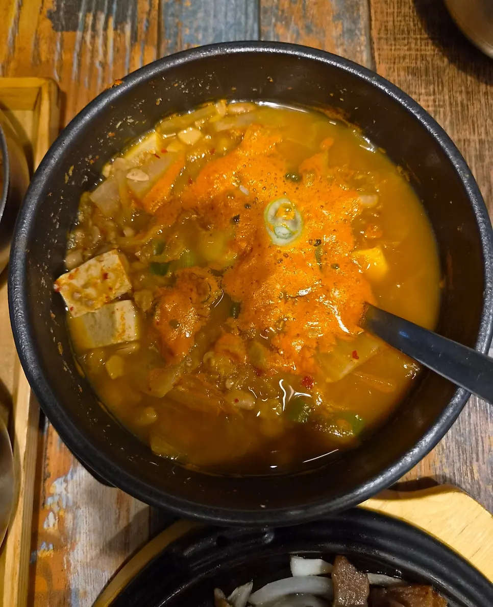 Hot stew served with a Korean set meal