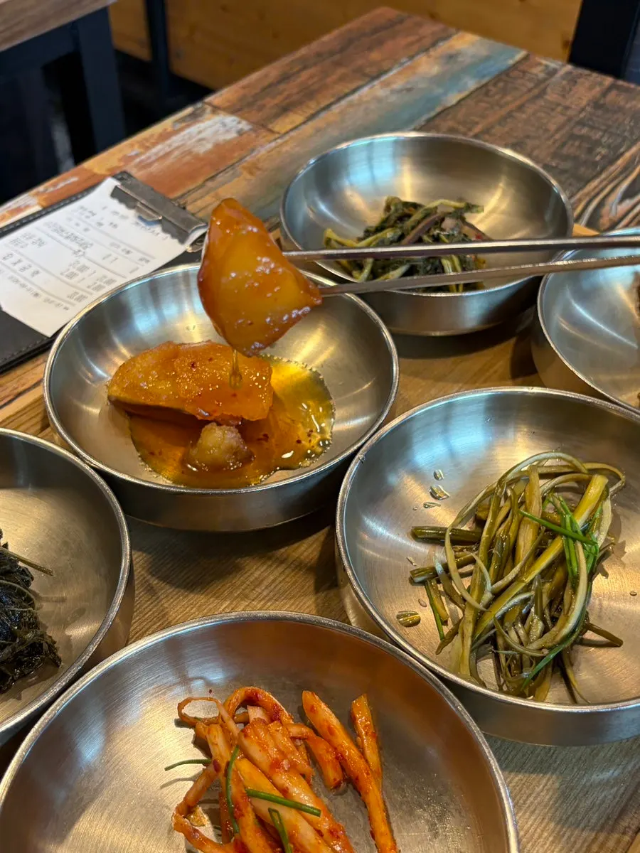 Spoonful of pot rice with banchan