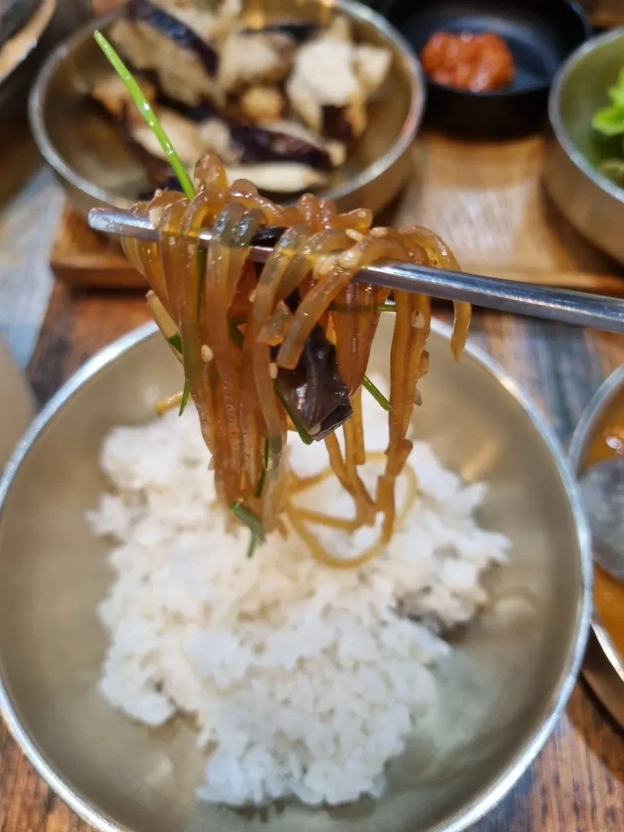 A plate of pickled pepper banchan and more