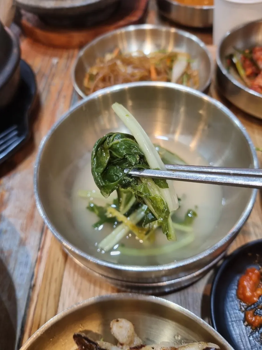 Rice mixed with vegetables, gochujang, and cheonggukjang