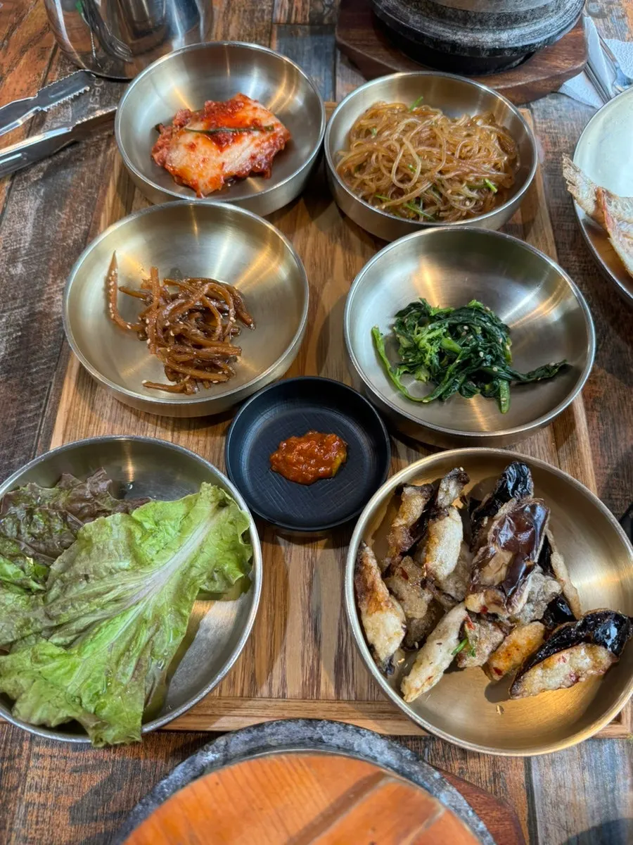 Korean set-meal table with varied side dishes