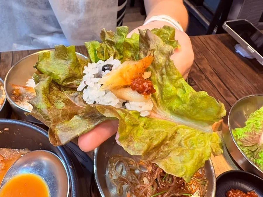 A piece of borigulbi placed on top of green tea rice
