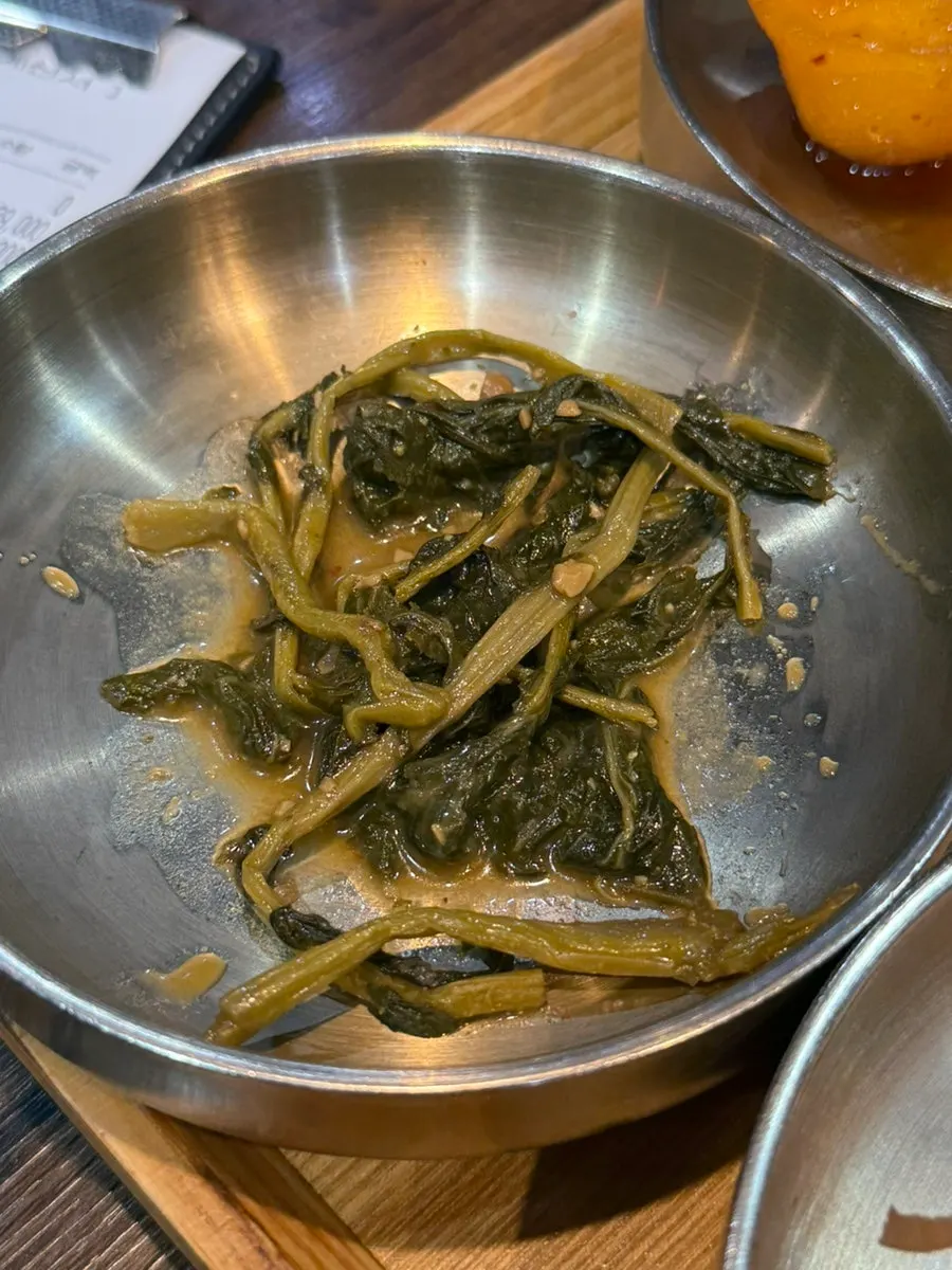 Table filled with several banchan dishes