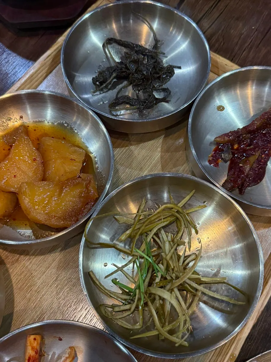 Pot rice served alongside banchan
