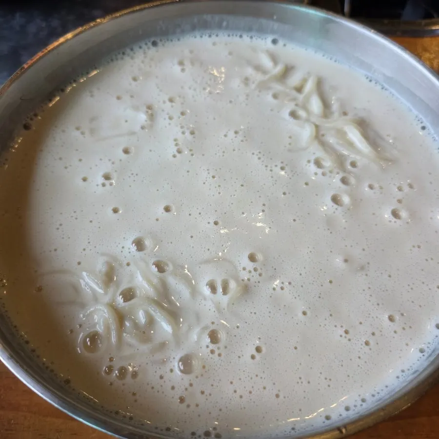 A bowl of soy milk noodles with nutty broth